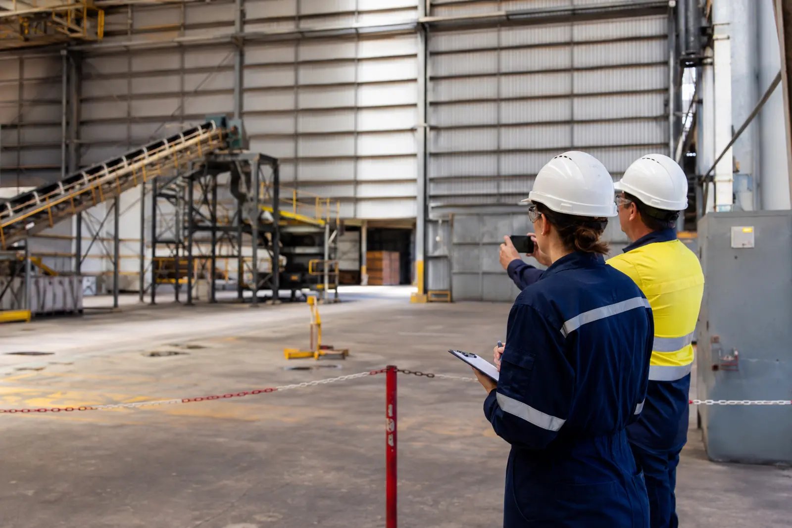 WHS investigator gathering information in a safely isolated industrial work area